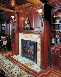 Fireplace Mantel and Surrounding Cabinets in this custom home.