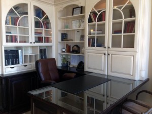 raised panel white cabinets are part of this beautiful home office