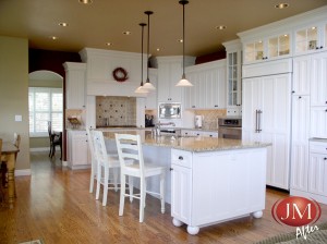 White Painted Cabinets with Hardwood Floors After Remodel