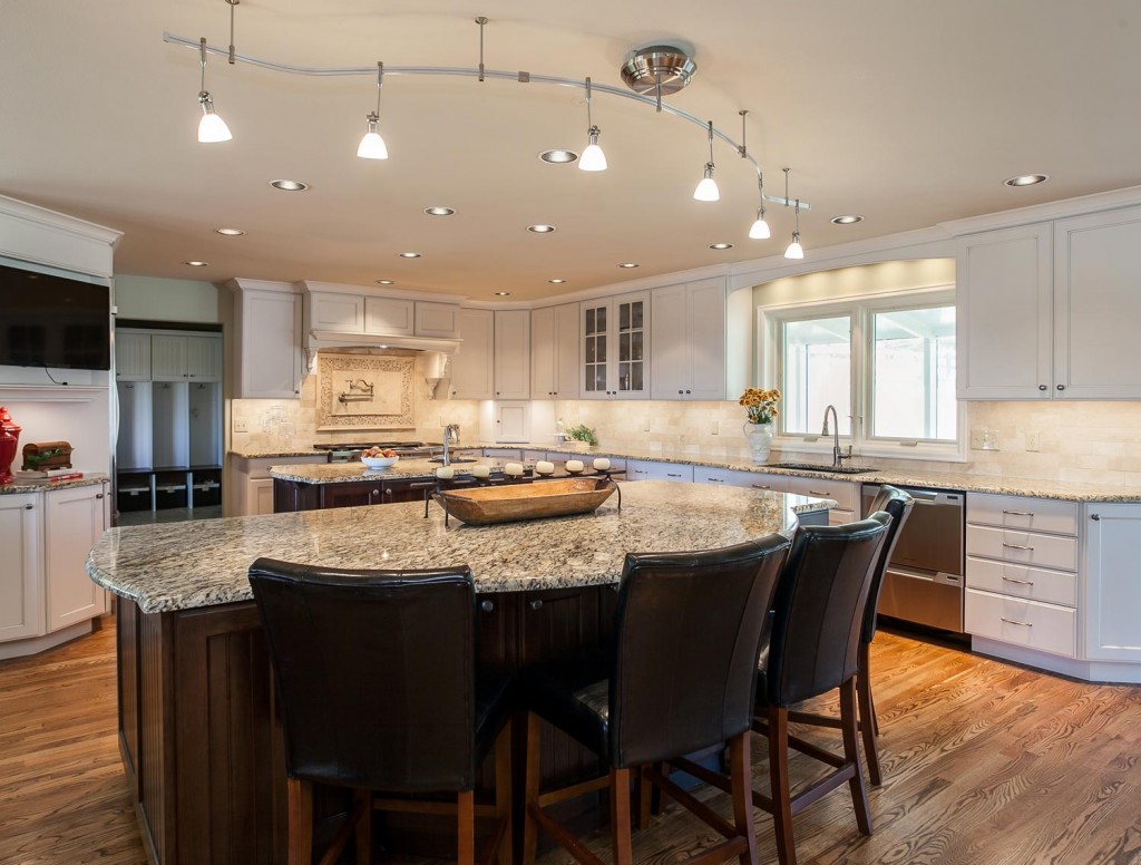 Lots of custom lighting in this gorgeous kitchen great room renovation project in Denver CO