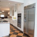 White shaker cabinet kitchen with stainless steel appliances
