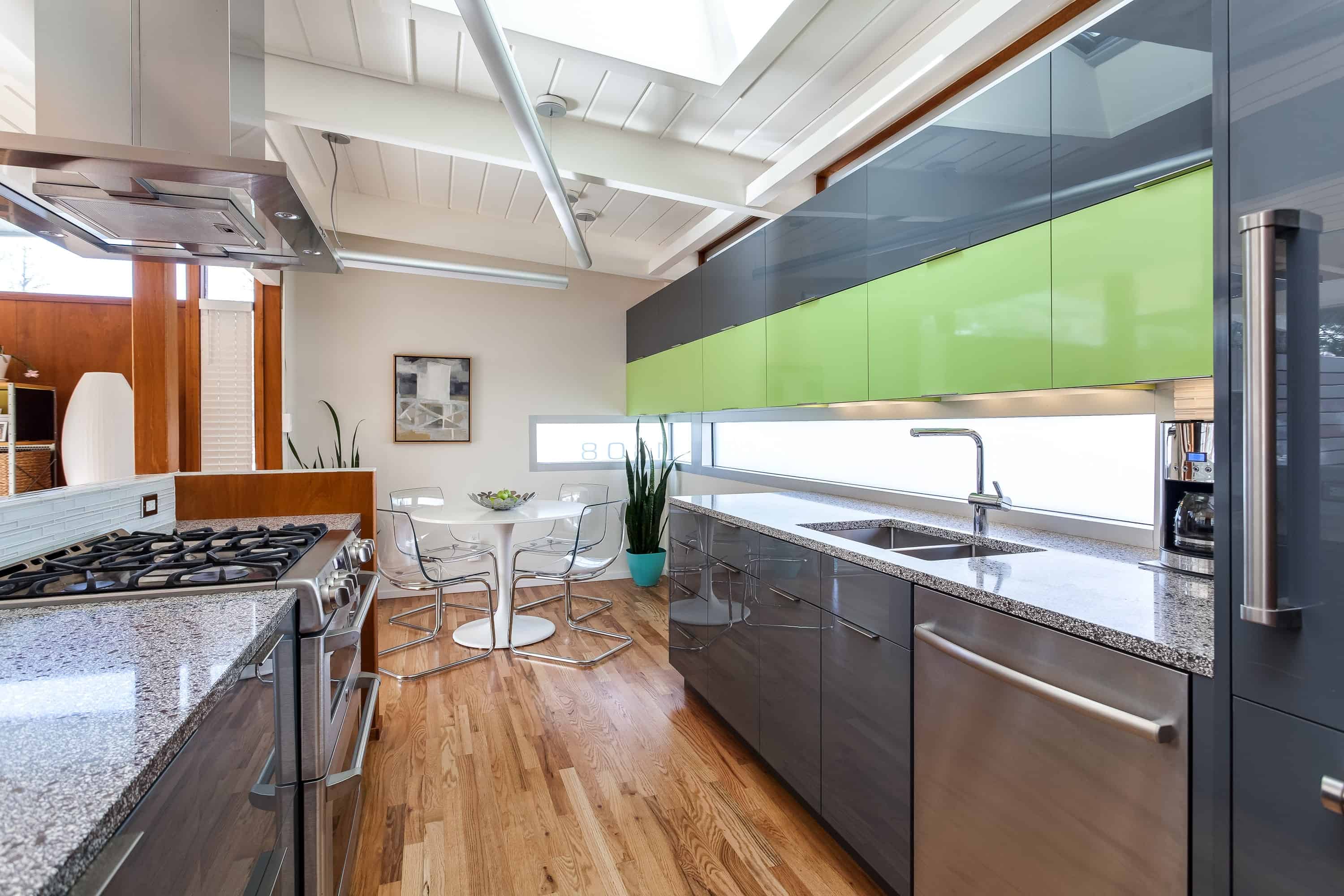 Sleek glass cabinets with stainless steel appliances