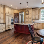 Expansive Distressed Painted Cabinet Kitchen Remodel with Wood Island