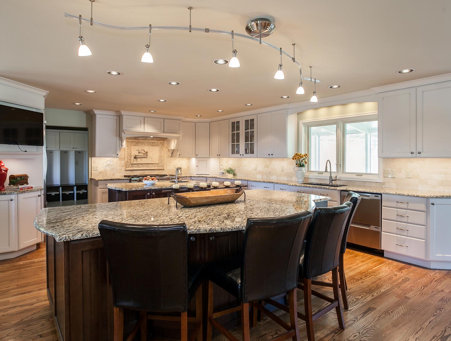 Center island with granite in kitchen