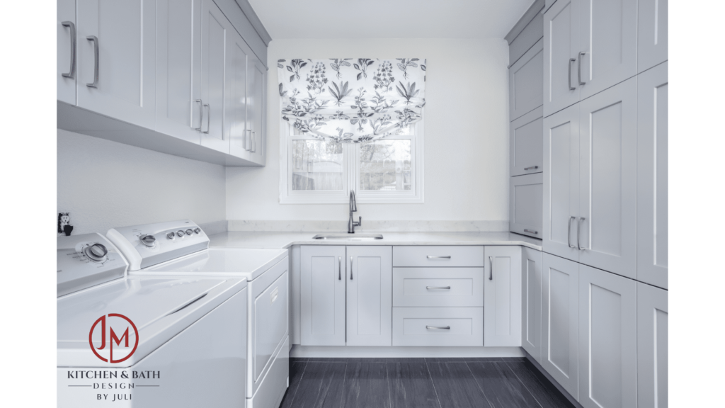 Laundry room / Mud room with painted white cabinets designed by Juli