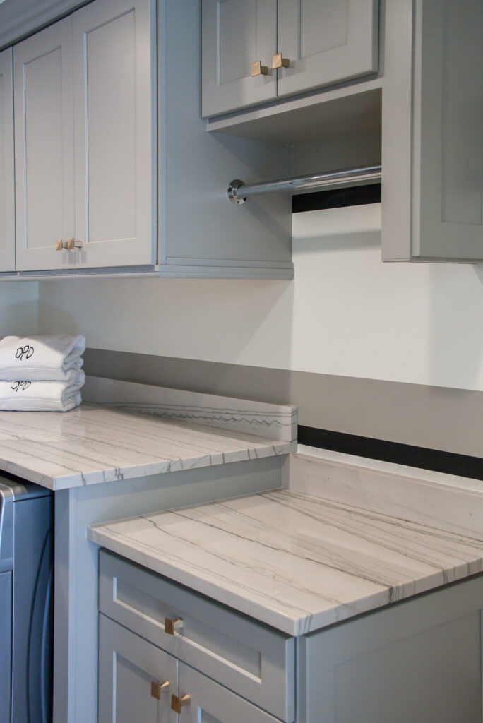 countertop and hanging space in this laundry room renovation